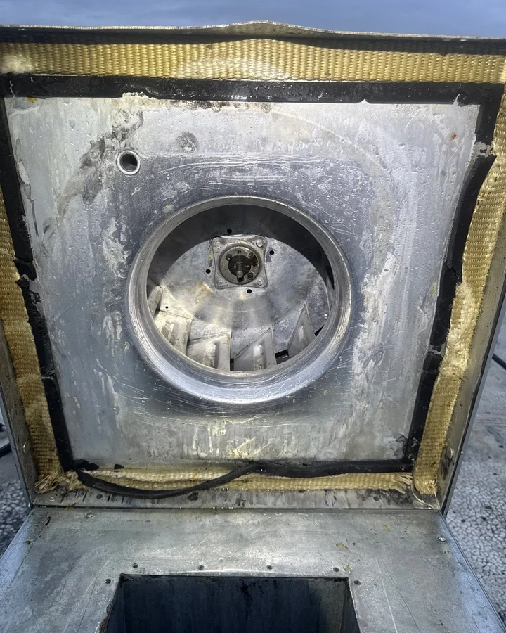 Cleaned commercial kitchen exhaust fan housing after hood cleaning